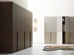 Ocean Wide wardrobe with curved groove handles, also single-coloured with configurable panels in the same finish