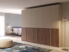 Ocean Wide wardrobe with groove handles in two-tone version: sand matt lacquer and natural walnut veneer