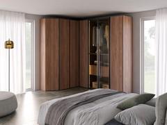 Hinged wardrobe consisting of end unit, corner element and module with bronze glass doors. Splendid material and colour contrast between wood, glass and metal.