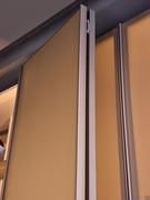 Detail of the open folding door, an excellent space-saving solution since, once the opening has been completed, it is completely folded back on itself