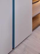 Detail of the matt lacquered groove, the most recognisable element in Lake Wide wardrobes