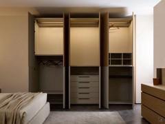 Example of interior equipment in the Ocean Wide wardrobe: shelves, hangers, LED lights, floor-standing drawers, raster and pull-out trouser rack