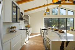 Kitchen working area with wall units and island with appliances