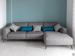 Sofa with gray chaise longue. 3-seater model with tall slender feet.