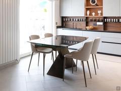 Dining area set up next to the kitchen. Table with 4 chairs.