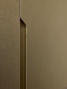 Detail of the handle of the floor-to-ceiling wardrobe doors. Handle finished in metallic lacquer to match the doors