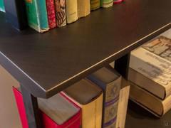 Detail of the profile of the bookcase shelves and Brushed Bronze lacquer finish.