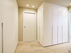 Hallway with capacious fitted wardrobes.