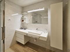 Furniture in the main bathroom of the house. Shelf with washbasin, wall-mounted drawer unit, counter column, shelves, mirror.