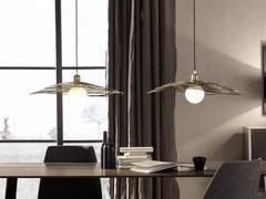 Design metal pendant lamp Nido by Cantori positioned above a table 