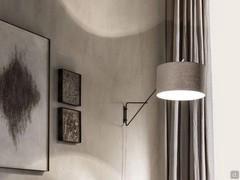 Lia vintage wrought iron lamp by Cantori in the wall sconce model, with adjustable lampshade.  