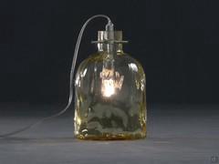 Boukali bottle shaped glass lamp in Amber finish