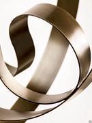 Detail of the curved bronze foil