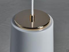 Detail of the fabric cable attachment to the white and gold diffuser