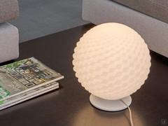 Agape table lamp with sphere-like shade, light switched on