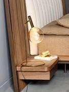 Lamp Sofì by Bonaldo in the table version, here paired with the Nelson bed on integrated nightstands