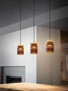 Trio of hanging lamps Tread in burnt-earth colored fluted glass matching the gold frame