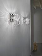 Pair of Ecos wall lights with chromed metal frames and transparent crystal rings