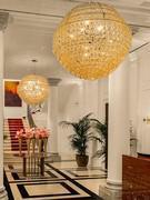 Pair of Giogali sphere chandeliers illuminating an important and elegant entrance hall