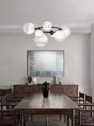 7-point pendant lamp with white glass spheres and satin black nickel metal frame