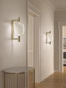 Riflesso In the glass wall sconce version with satin gold frame