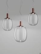 Lamps Riflesso in small and large versions with a satin copper tip