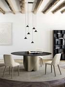 Lola chandelier with glass and metal diffusers combined with the Torquay table from the same collection