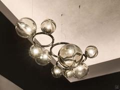 Detail of the blown glass spheres, in 3 different sizes, containing the 9 light points