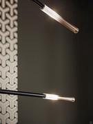 Detail of the shaded amber glass shade that characterises the Crossroad chandelier by Bonaldo