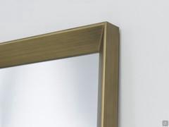 Details of the Plain frame, one of three available on the mirror Tema. Here offered in a bronzed metal finish