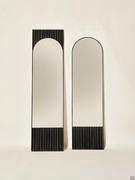 Domu mirror standing against the wall in the two available measurements and in black ash wood