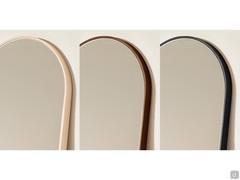 Detail of the thin frame running around Domu mirror upper arc-shaped side, in the three finishes available