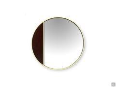 Cayos round mirror with one side covered in fabric