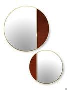 Composition of Cayos round mirror in brass with one part covered in fabric