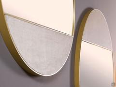 Detail composition of two Cayos mirrors with brass profile and Elina velvet-covered parts