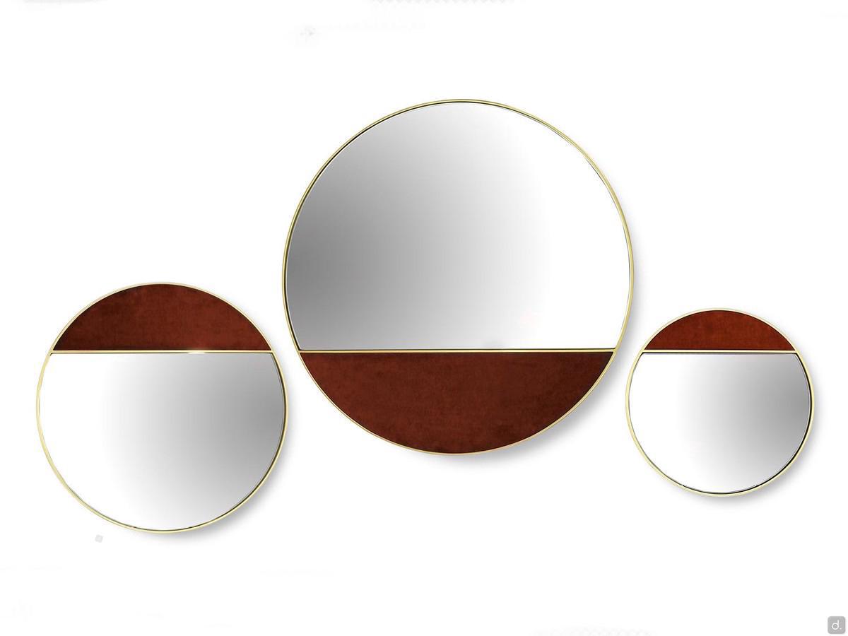 Composition of Cayos round mirror in brass with one part covered in fabric