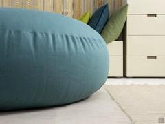 Round ottoman filled with polyesterene fibre