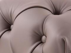 Detail of the tufted design of the Bellagio ottoman in Nuvola leather