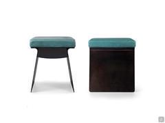 Front and side view of the Calvin designer pouffe stool, with a slim metal structure, which can be open or closed, and seat cushion with leather upholstery