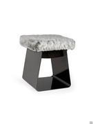 The Calvin pouffe stool with a closed metal structure and seat cushion upholstered in synthetic fur (extra, not in the sample book)