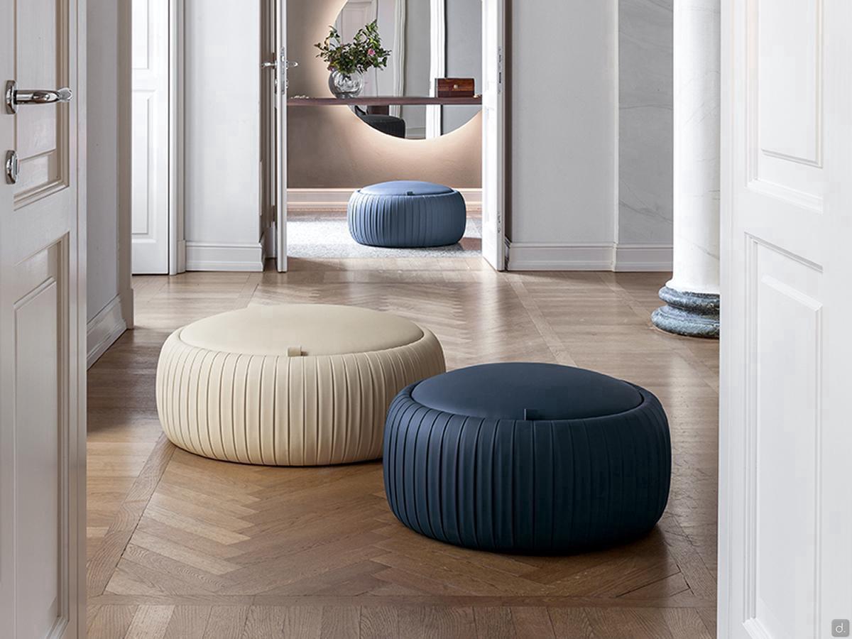 Pouf upholstered in Plissé leatherette, available in multiple sizes and finishes