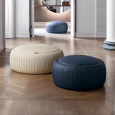 Plissé leatherette upholstered pouf