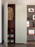 The left column of this closet is intended for wardrobe, organized with hanging tube and shelves