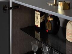 Interior view of the Oyster outlet sideboard with one of the movable smoked glass shelves in the foreground