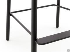 Detail of structure with matt black painted metal footrest