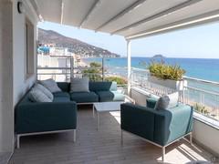 Terrace with motorised opening pergola for protection from the sun.