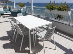 Terrace furnished with sofa area and table. 