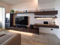 Modern wall unit with writing desk, display cabinet, shelves, drawers