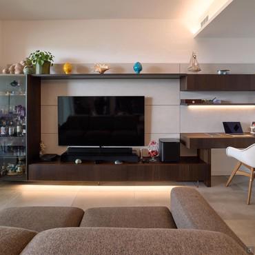 Living room wall unit with display cabinet and shelf for desk use