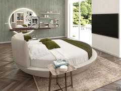 Master bedroom with centre bed and dressing area with hanging shelves, mirror and pouf